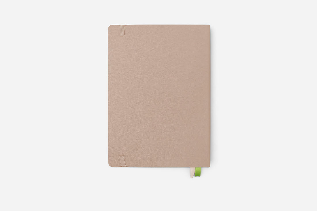 Beige notebook on a white background