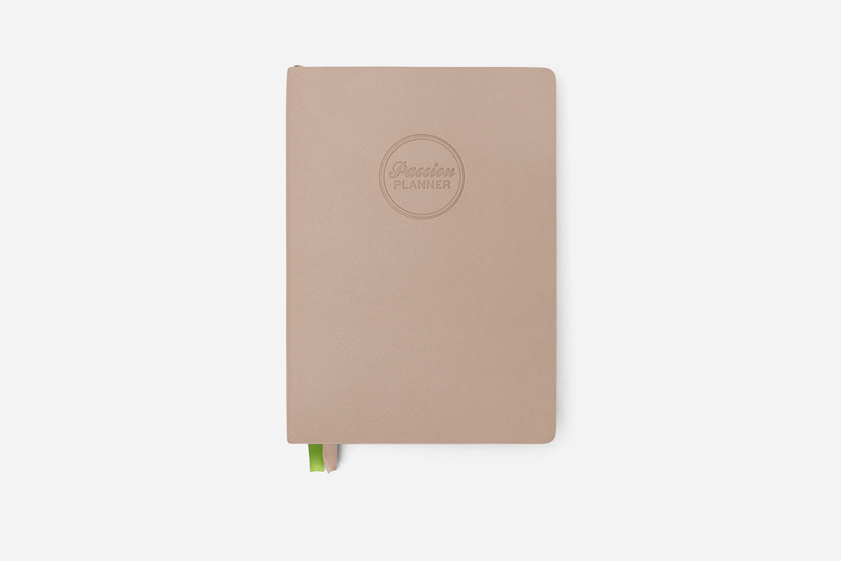 Beige planner with a brand logo on a white background