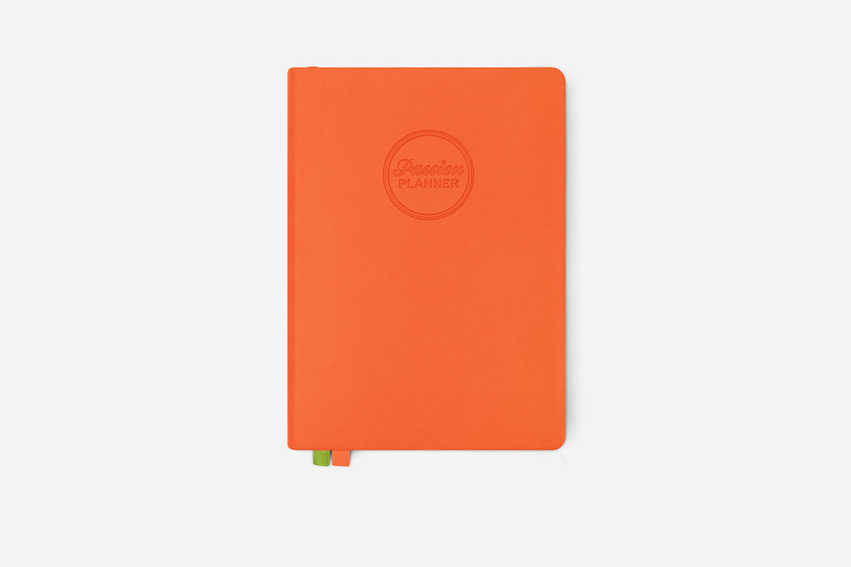 Orange planner with a brand logo on a white background