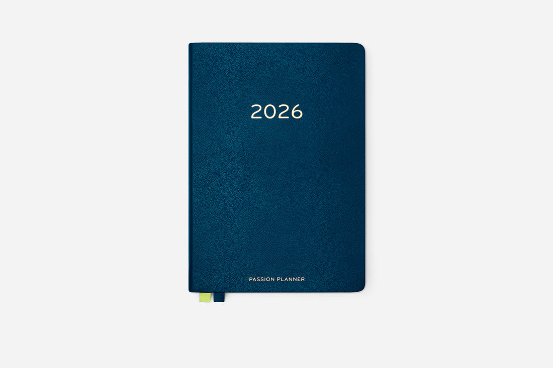 Navy blue hardcover planner with &