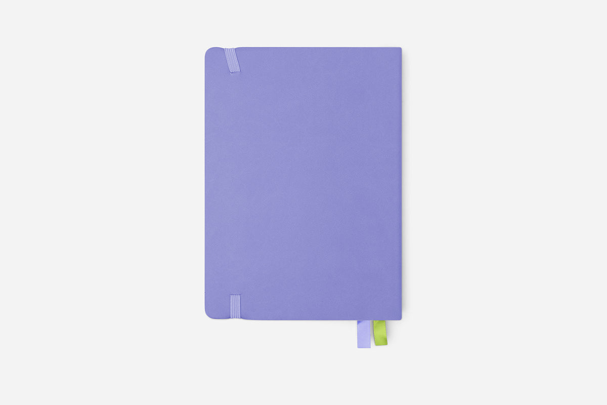 Purple planner with a green bookmark on a white background
