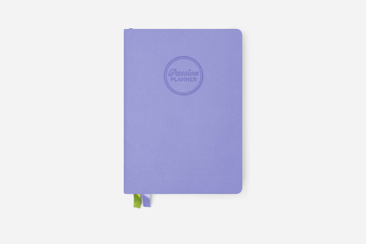 Purple planner with a Passion Planner logo on a white background