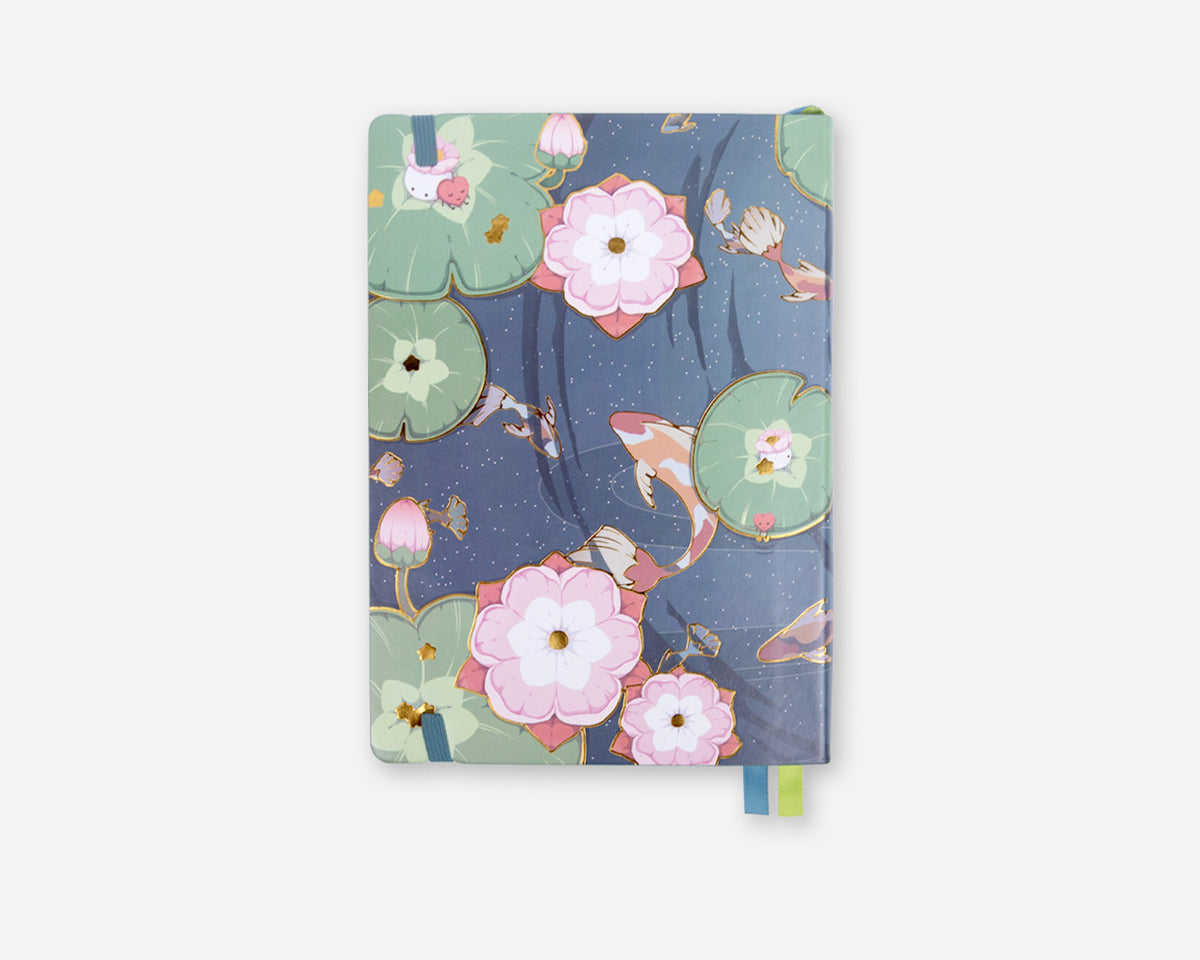 Planner with floral and fish design on a white background