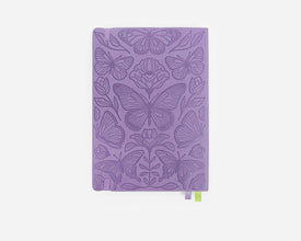 Purple notebook with butterfly design on a white background