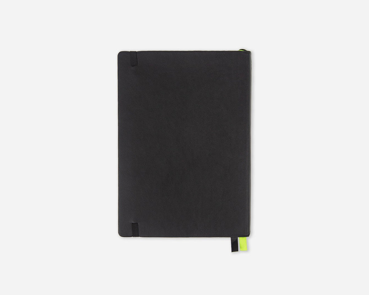 A black faux leather notebook or journal with a small lime green bookmark tab, shown closed on a light gray background.