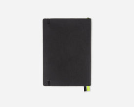 A black faux leather notebook or journal with a small lime green bookmark tab, shown closed on a light gray background.