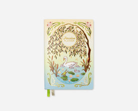 A pastel illustrated planner cover featuring a pond scene with a white swan, lily pads, a willow tree, and the words 'Passion Planner' in a circular frame. The cover has a cream-to-light-blue gradient background with green and pink decorative accents.