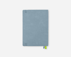 A light blue 2027 planner with a textured cover, featuring a small green ribbon bookmark peeking out from the bottom right corner, set against a plain light gray background.
