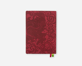 A 2027 planner featuring a dark red embossed ram design and a small green and red ribbon bookmark, shown on a light gray background.