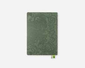 A 2027 planner with a dark sage green cover featuring an embossed swirling wave pattern and goat illustration, shown on a light gray background with a small green bookmark tab visible at the bottom right.