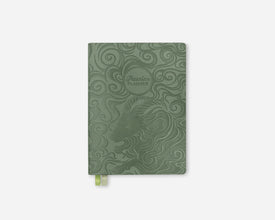 A sage green 2027 weekly planner with embossed swirl patterns and a zodiac-themed goat illustration, featuring a small green ribbon bookmark at the bottom, shown on a light gray background.