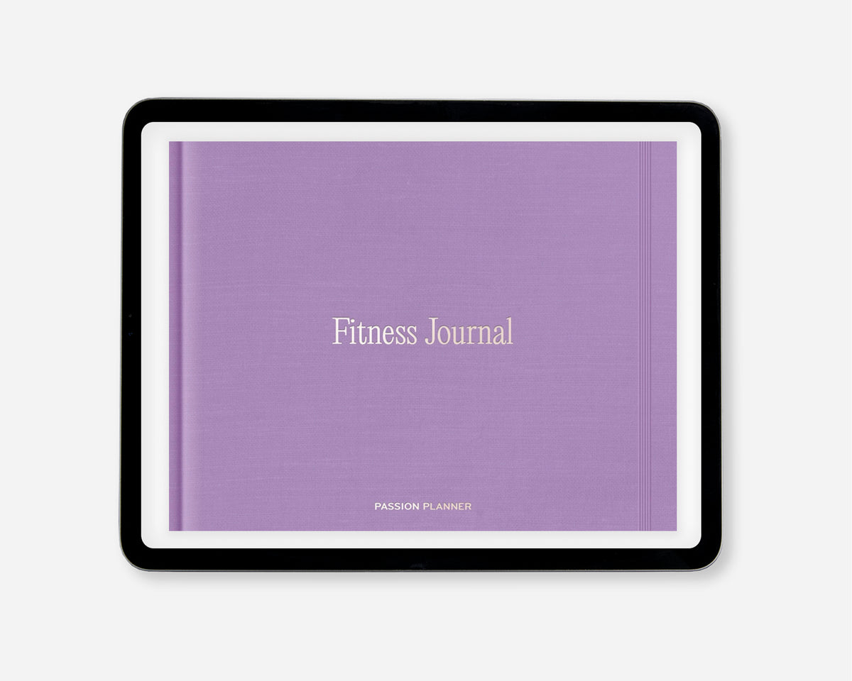 A digital fitness journal with a textured lavender purple cover, featuring the words 'Fitness Journal' in a light beige serif font. The journal is presented in a black tablet-style frame against a clean, light gray background.
