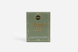 Box of affirmation cards with decorative design on a white background
